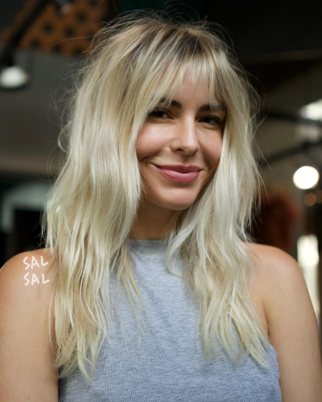 Blonde Hairstyle with Light Bangs for Thin Hair