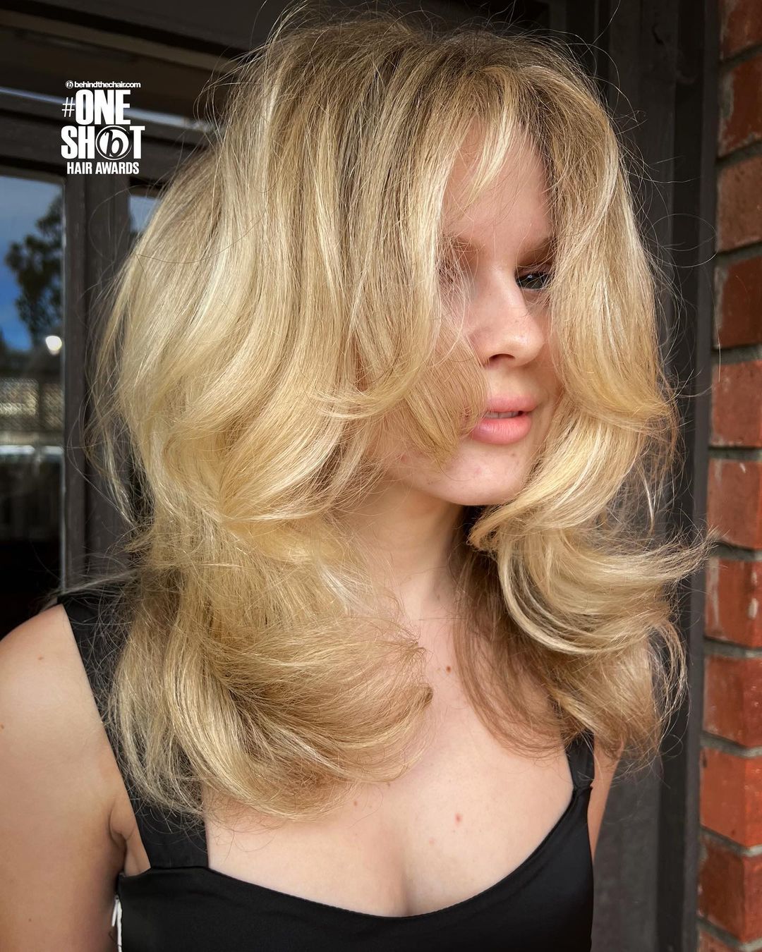 Voluminous Warm Blonde Hairstyle with Framing Layers