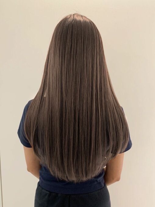 girl standing in a U cut hairstyle